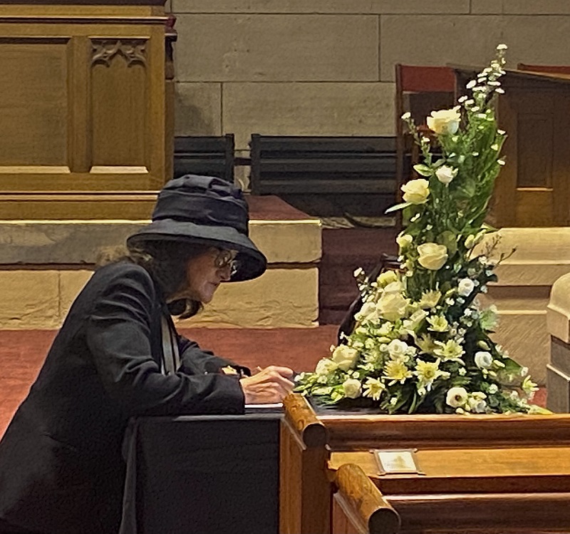 Nancy Robson DL opening the Book of Condolence at St Gerardines Church, Lossiemouth, following the death of Her Majesty the Queen