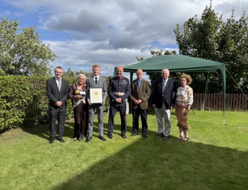 Presenting the Elizabeth Emblem to Callum Alcock in Garmouth